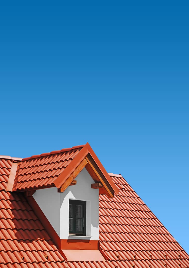 Roof,With,Red,Tiles,On,A,Background,Of,Blue,Sky,