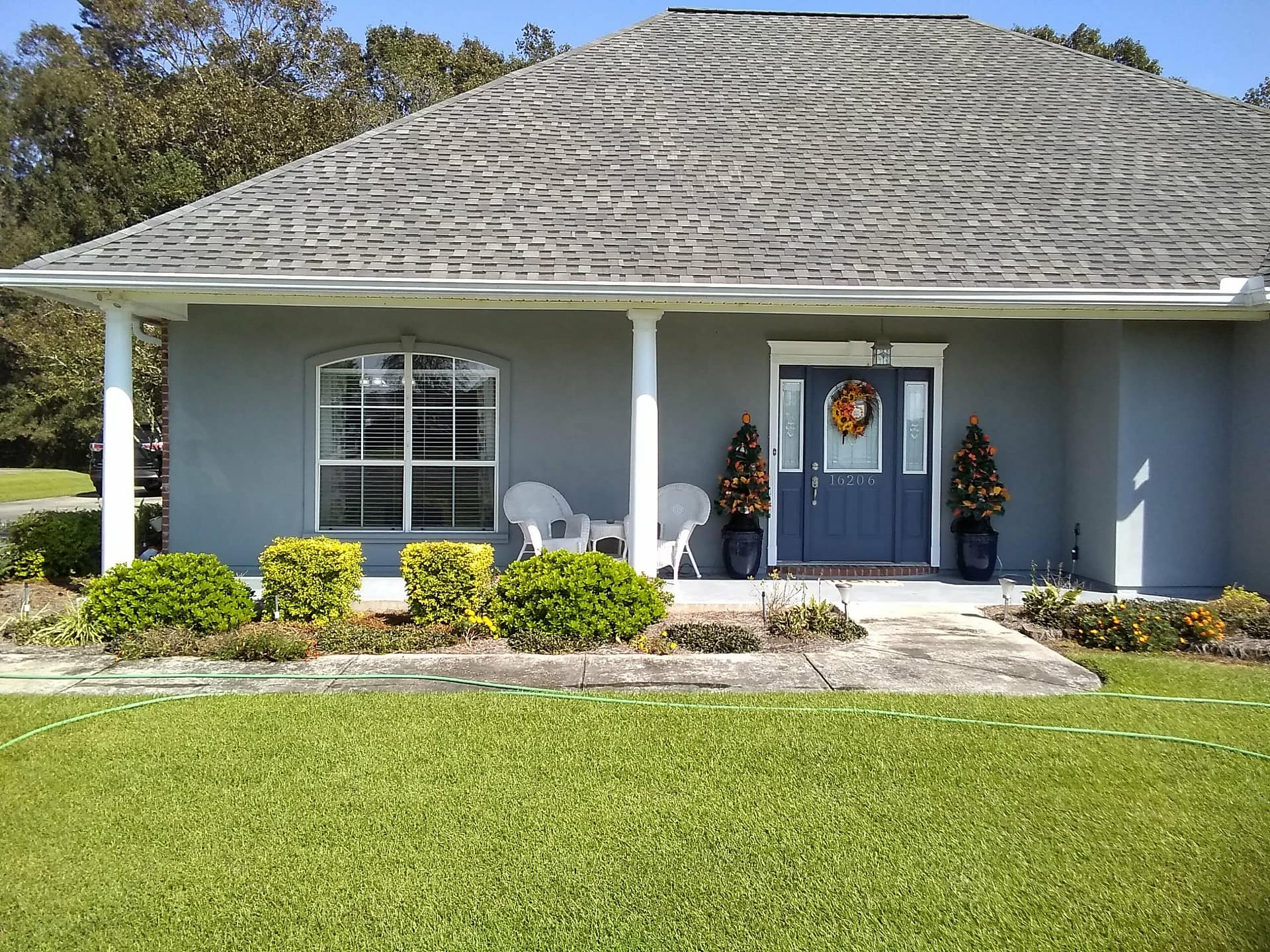 Cajun Soft Wash residential roof cleaning exterior dirt window